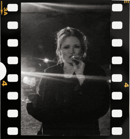 Liz smoking a cigar